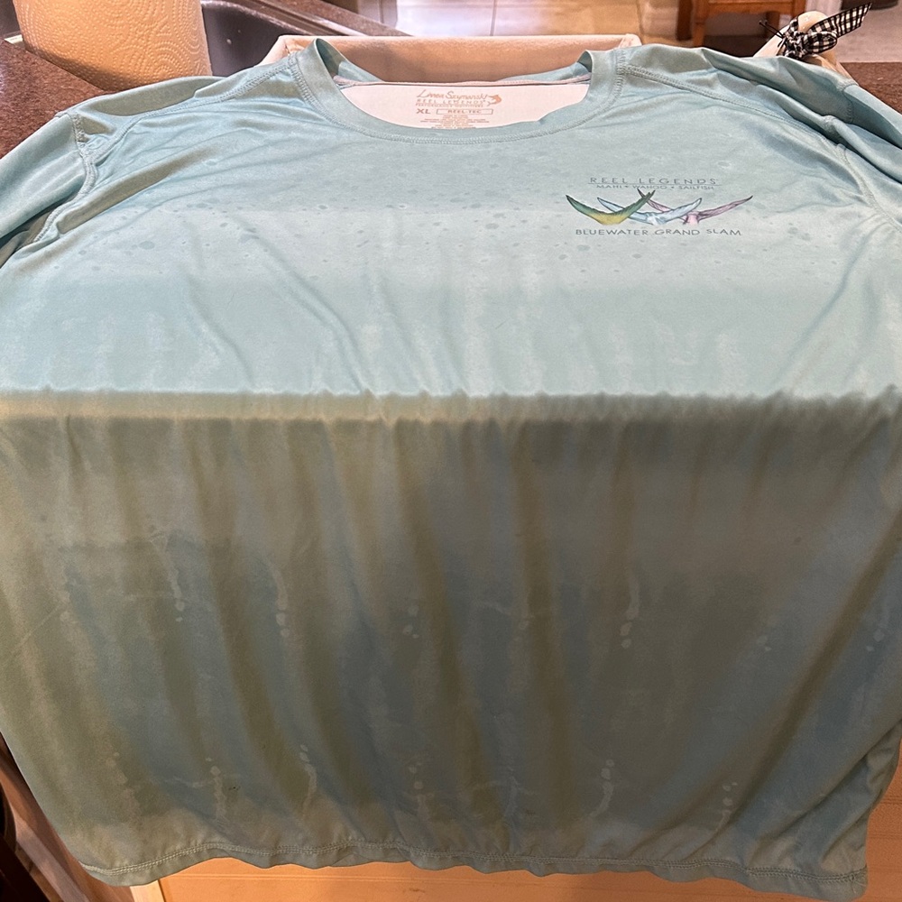 5/$25.00 Reel Legends Linnea Szymanski xl performance Light Blue Long Sleeve Tee